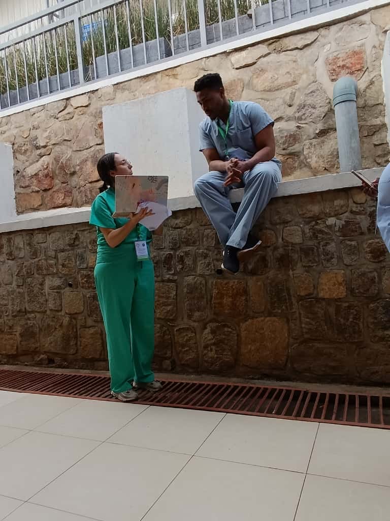 Dr. Umoren teaching medical students conducting research in Rwanda