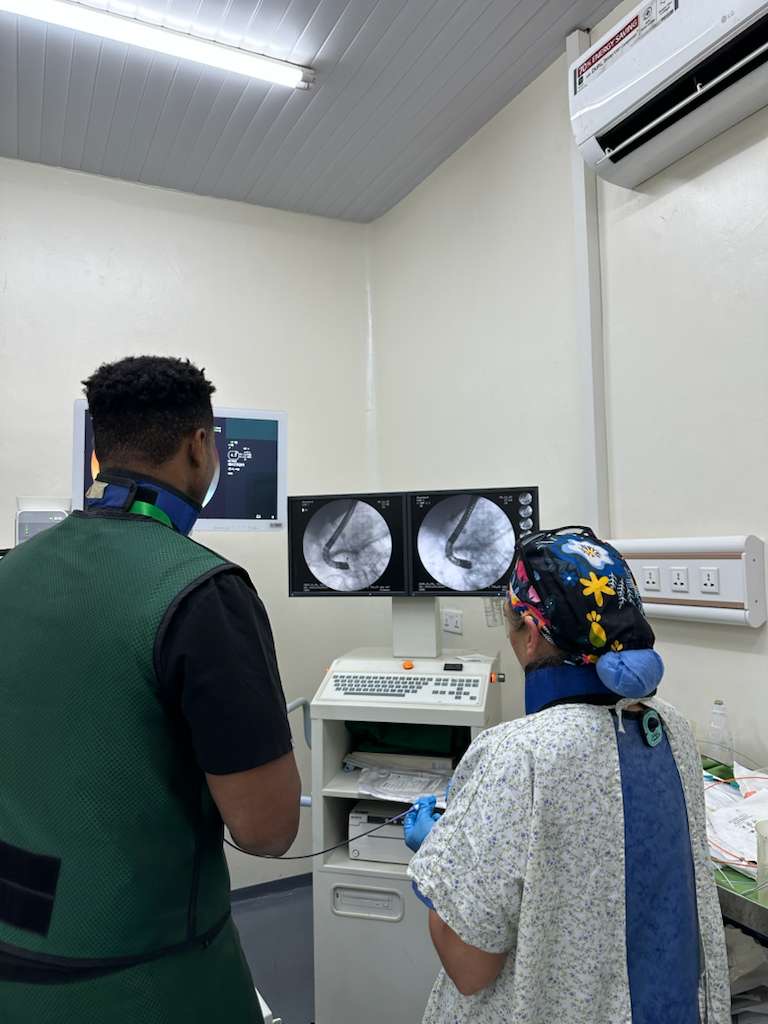 Dr. Umoren with his endoscopy technician during a procedure in Rwanda